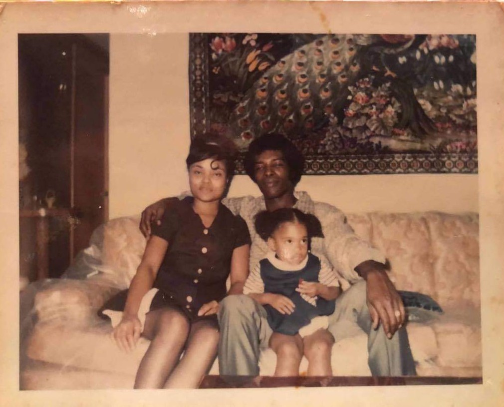 Veronica Womack with her mother and father in a family photo